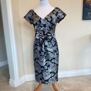 Cocktail dress by CHETTA B. Short sleeves, black & silver in color.